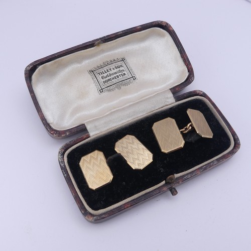 358 - A cased pair of 9ct gold Cufflinks, of rectangular form with canted corners and engine turned decora... 