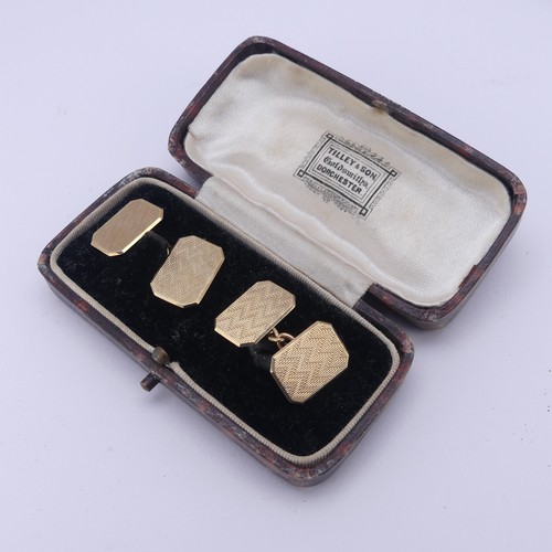 358 - A cased pair of 9ct gold Cufflinks, of rectangular form with canted corners and engine turned decora... 