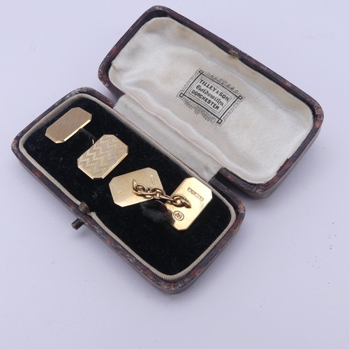 358 - A cased pair of 9ct gold Cufflinks, of rectangular form with canted corners and engine turned decora... 