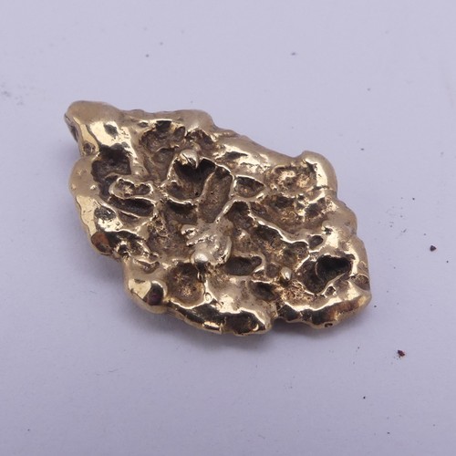 256 - A 9ct yellow gold 'Nugget' Ingot Pendant, hallmarked London 1977, 2.8cm long, 8.4g.