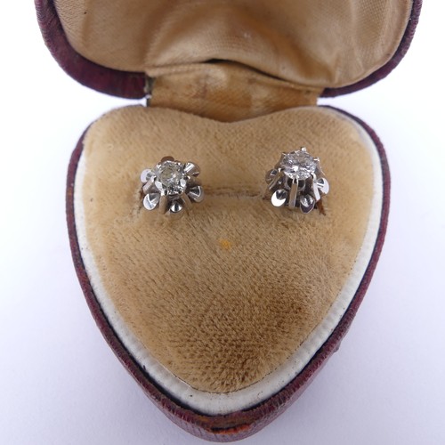 324 - A pair of diamond single stone stud Earrings, the brilliant cut stones each approx. 0.15ct, claw set... 