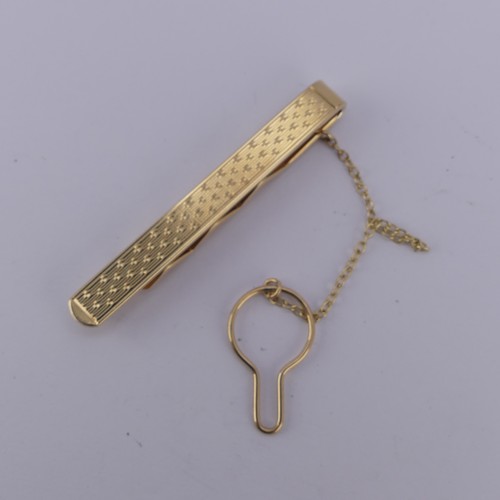 361 - A 9ct yellow gold Tie Pin, with engine turned decoration, 7.5g.