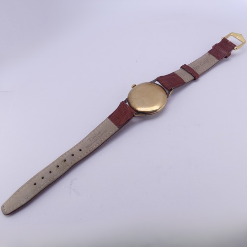 134 - A vintage 9ct gold Accurist Wristwatch, the champagne dial with gilt Arabic numerals and hands, subs... 