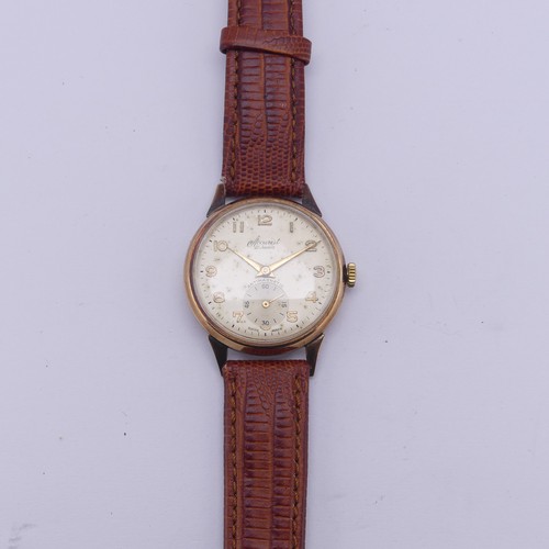 134 - A vintage 9ct gold Accurist Wristwatch, the champagne dial with gilt Arabic numerals and hands, subs... 