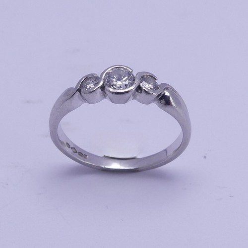 166 - A graduated three stone diamond Ring, the centre stone approx. 0.22ct, all mounted in platinum, Size... 