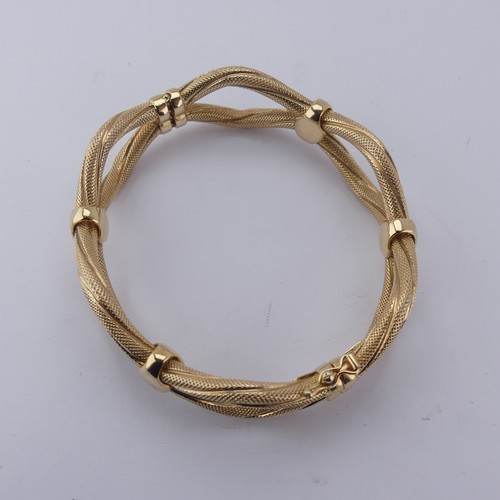 289 - A 9ct yellow gold hollow hinged Bangle, the two textured wavy strands joined with polished loops, sp... 