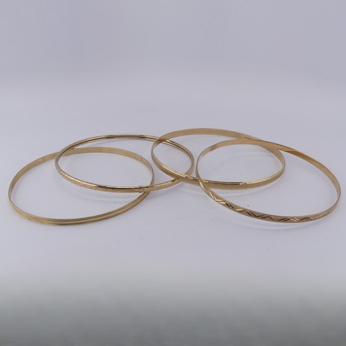 291 - Four 9ct yellow good Slave Bangles, various engraved decoration, approx. total weight 17.1g (4)... 