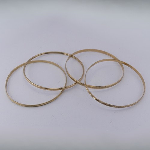 291 - Four 9ct yellow good Slave Bangles, various engraved decoration, approx. total weight 17.1g (4)... 