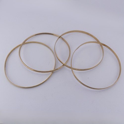 291 - Four 9ct yellow good Slave Bangles, various engraved decoration, approx. total weight 17.1g (4)... 