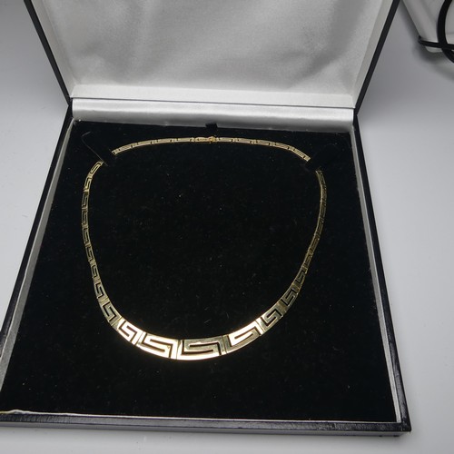 259 - A graduated 14ct yellow gold Greek Key link Necklace, the largest link 10mm wide, approx. total leng... 