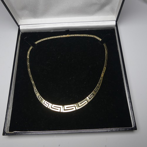 259 - A graduated 14ct yellow gold Greek Key link Necklace, the largest link 10mm wide, approx. total leng... 