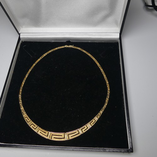 259 - A graduated 14ct yellow gold Greek Key link Necklace, the largest link 10mm wide, approx. total leng... 