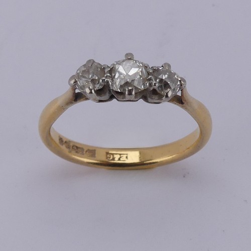 167 - A graduated three stone diamond Ring, the central old cut stone approx. 0.3ct, with a smaller stone ... 