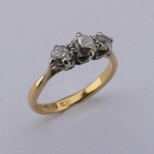 167 - A graduated three stone diamond Ring, the central old cut stone approx. 0.3ct, with a smaller stone ... 