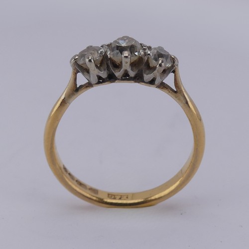 167 - A graduated three stone diamond Ring, the central old cut stone approx. 0.3ct, with a smaller stone ... 