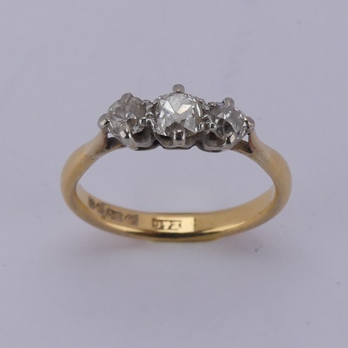 167 - A graduated three stone diamond Ring, the central old cut stone approx. 0.3ct, with a smaller stone ... 