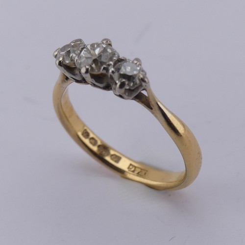 167 - A graduated three stone diamond Ring, the central old cut stone approx. 0.3ct, with a smaller stone ... 