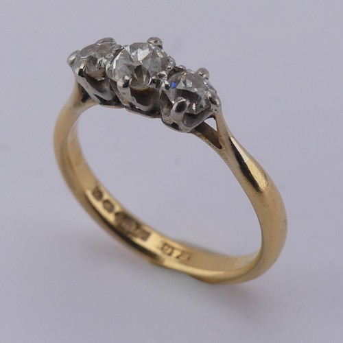 167 - A graduated three stone diamond Ring, the central old cut stone approx. 0.3ct, with a smaller stone ... 