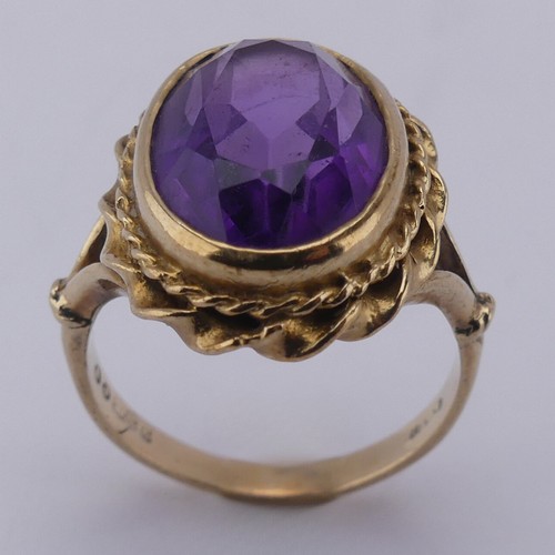 168 - An oval facetted Dress Ring, in 9ct ropetwist mount and shank, Size K, approx. total weight 5.2g.... 