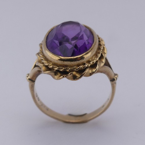 168 - An oval facetted Dress Ring, in 9ct ropetwist mount and shank, Size K, approx. total weight 5.2g.... 