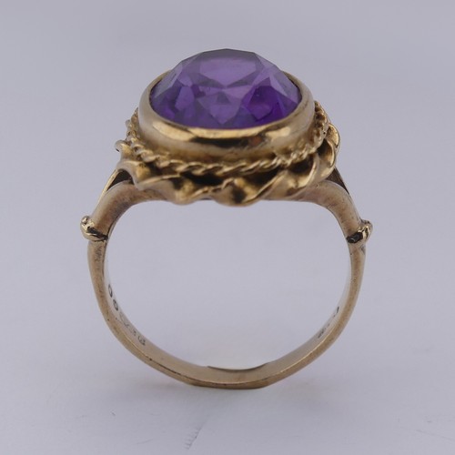 168 - An oval facetted Dress Ring, in 9ct ropetwist mount and shank, Size K, approx. total weight 5.2g.... 