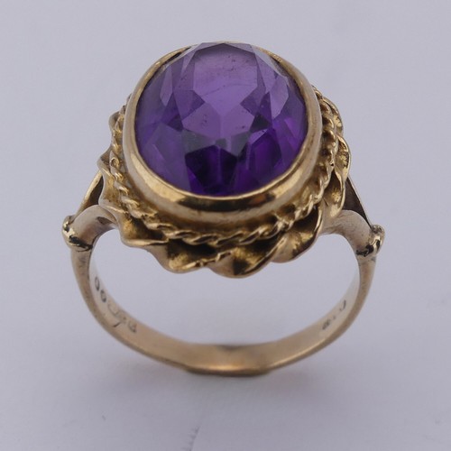 168 - An oval facetted Dress Ring, in 9ct ropetwist mount and shank, Size K, approx. total weight 5.2g.... 