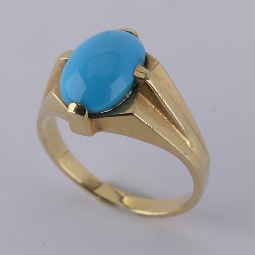 170 - An oval cabochon turquoise Ring, the stone 10mm long, four claw set in modernist yellow gold mount, ... 