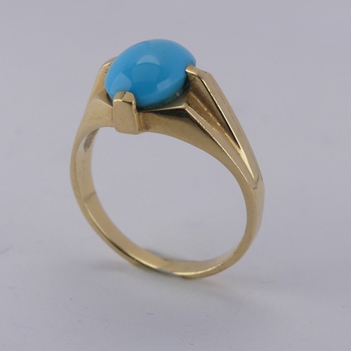 170 - An oval cabochon turquoise Ring, the stone 10mm long, four claw set in modernist yellow gold mount, ... 