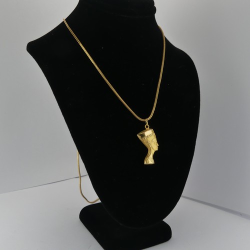 262 - An 18ct yellow gold Nefertiti Pendant / Charm, 25mm long, on an 18ct snakelink chain, 79cm long, tot... 