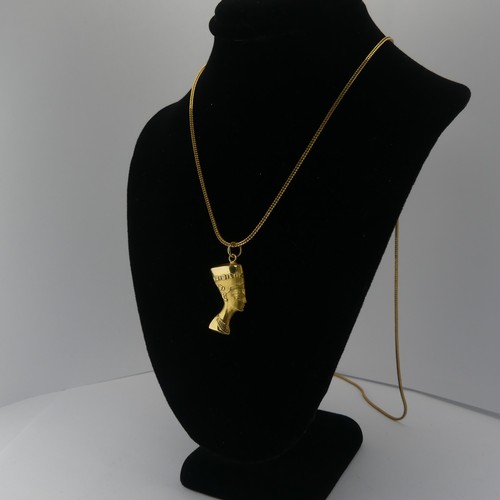 262 - An 18ct yellow gold Nefertiti Pendant / Charm, 25mm long, on an 18ct snakelink chain, 79cm long, tot... 