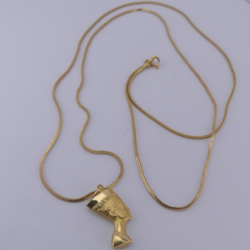 262 - An 18ct yellow gold Nefertiti Pendant / Charm, 25mm long, on an 18ct snakelink chain, 79cm long, tot... 