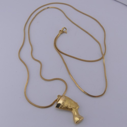 262 - An 18ct yellow gold Nefertiti Pendant / Charm, 25mm long, on an 18ct snakelink chain, 79cm long, tot... 