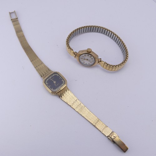 136 - A 9ct yellow gold lady's Tissot quartz Wristwatch, with black dial and integral bracelet strap, dama... 