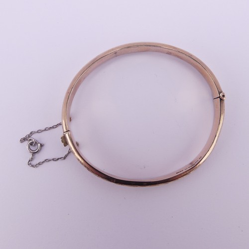 293 - A 9ct rose gold hollow hinged Bangle, as found, 7.5g.