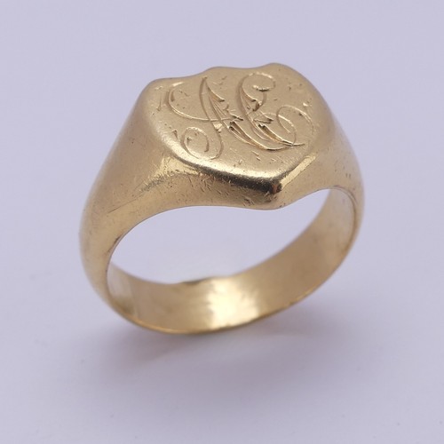 176 - An 18ct yellow gold Signet Ring, the shield shaped front engraved with initials, Size U, 13.8g.... 