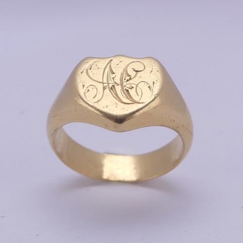 176 - An 18ct yellow gold Signet Ring, the shield shaped front engraved with initials, Size U, 13.8g.... 