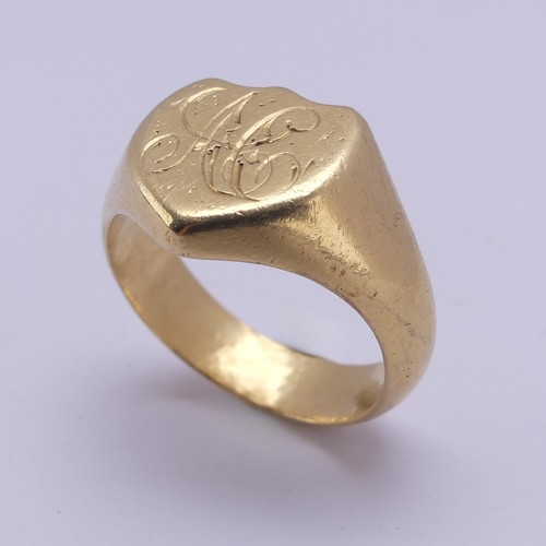 176 - An 18ct yellow gold Signet Ring, the shield shaped front engraved with initials, Size U, 13.8g.... 