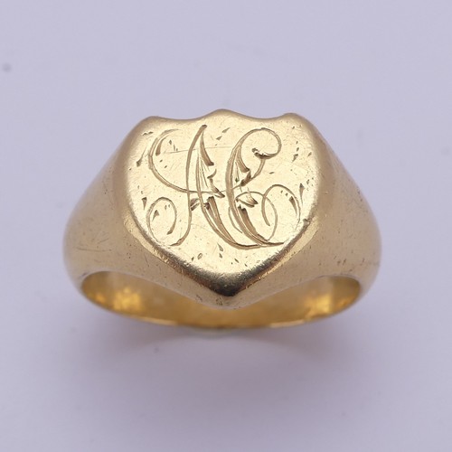 176 - An 18ct yellow gold Signet Ring, the shield shaped front engraved with initials, Size U, 13.8g.... 