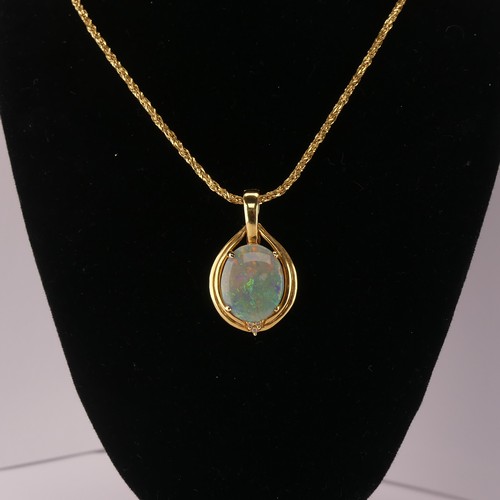 264 - An Opal and diamond Pendant, the oval cabochon opal 16mm x 13mm four claw set with three diamond acc... 