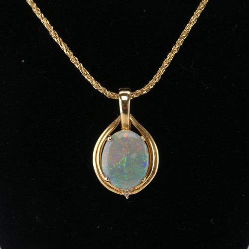 264 - An Opal and diamond Pendant, the oval cabochon opal 16mm x 13mm four claw set with three diamond acc... 