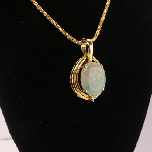 264 - An Opal and diamond Pendant, the oval cabochon opal 16mm x 13mm four claw set with three diamond acc... 