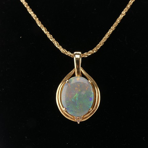 264 - An Opal and diamond Pendant, the oval cabochon opal 16mm x 13mm four claw set with three diamond acc... 