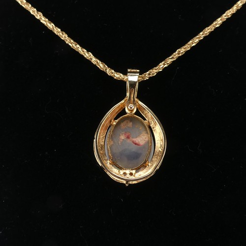 264 - An Opal and diamond Pendant, the oval cabochon opal 16mm x 13mm four claw set with three diamond acc... 