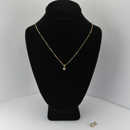 265 - A diamond solitaire Pendant, the brilliant cut stone approx. 0.2ct, on a 9ct yellow gold trace chain... 