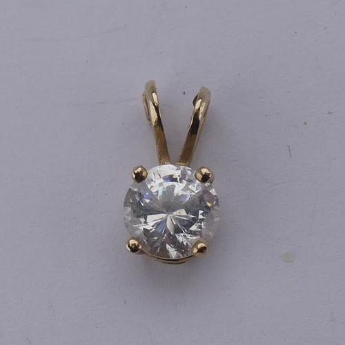 265 - A diamond solitaire Pendant, the brilliant cut stone approx. 0.2ct, on a 9ct yellow gold trace chain... 