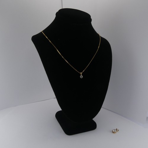 265 - A diamond solitaire Pendant, the brilliant cut stone approx. 0.2ct, on a 9ct yellow gold trace chain... 