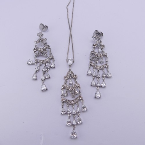 368 - A silver and white paste Pendant, 7cm long, together with a pair of corresponding drop earrings (3)... 