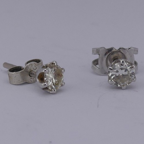 326 - A pair of single stone diamond Earrings, the brilliant cut stones each approx. 0.19ct, claw set in u... 