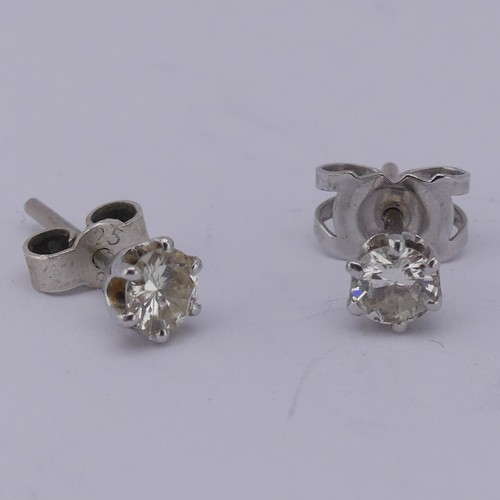 326 - A pair of single stone diamond Earrings, the brilliant cut stones each approx. 0.19ct, claw set in u... 