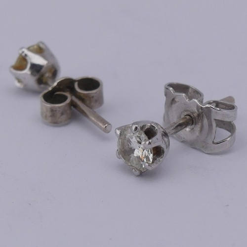 326 - A pair of single stone diamond Earrings, the brilliant cut stones each approx. 0.19ct, claw set in u... 